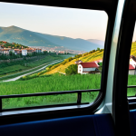 코소보 대중교통 이용법 - **Image Prompt 1: "Scenic Intercity Bus Ride in Kosovo"**
    A bright, clean but not overly modern ...